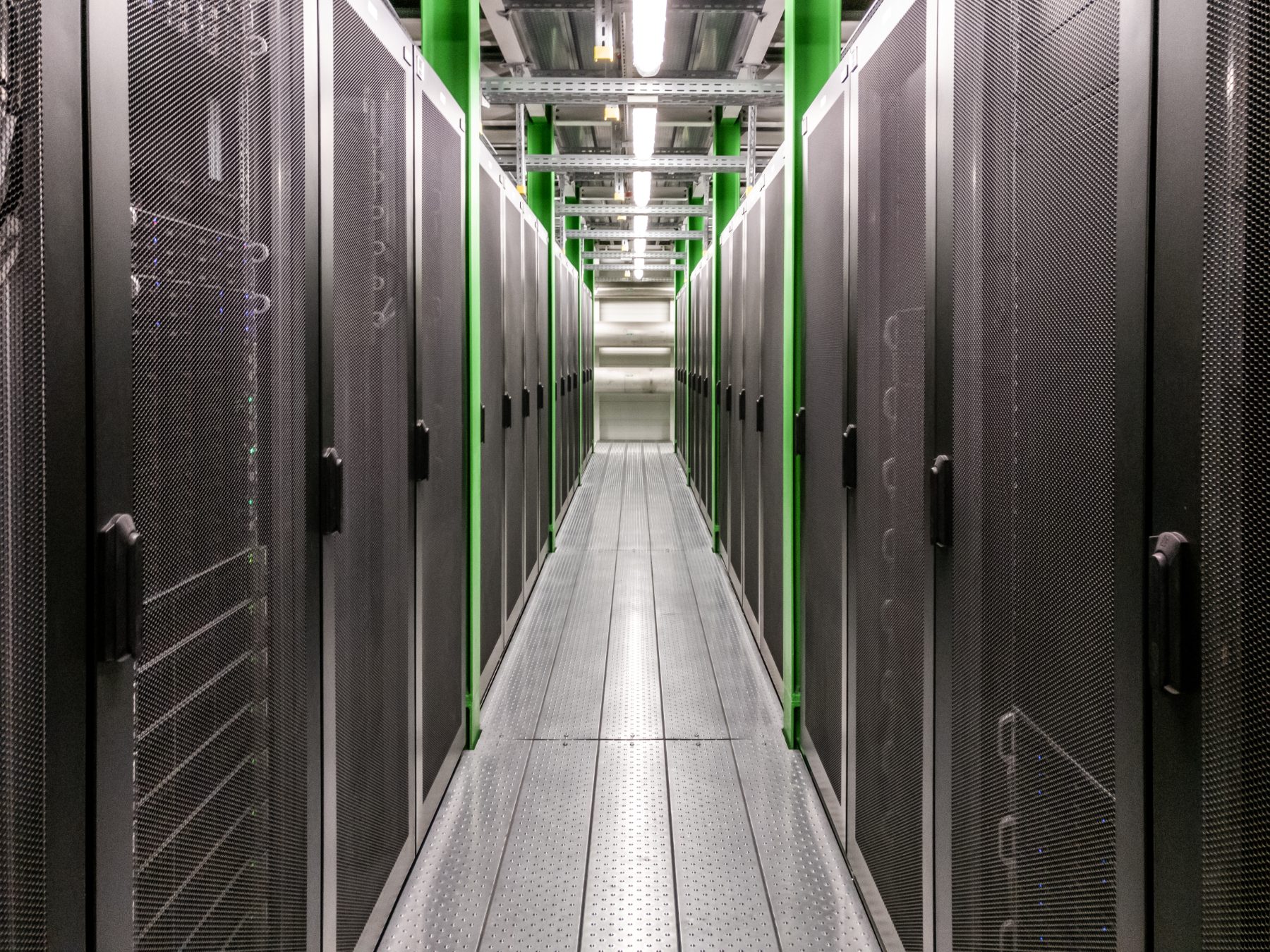 Server racks along a data centre corridor Server racks along a data centre corridor